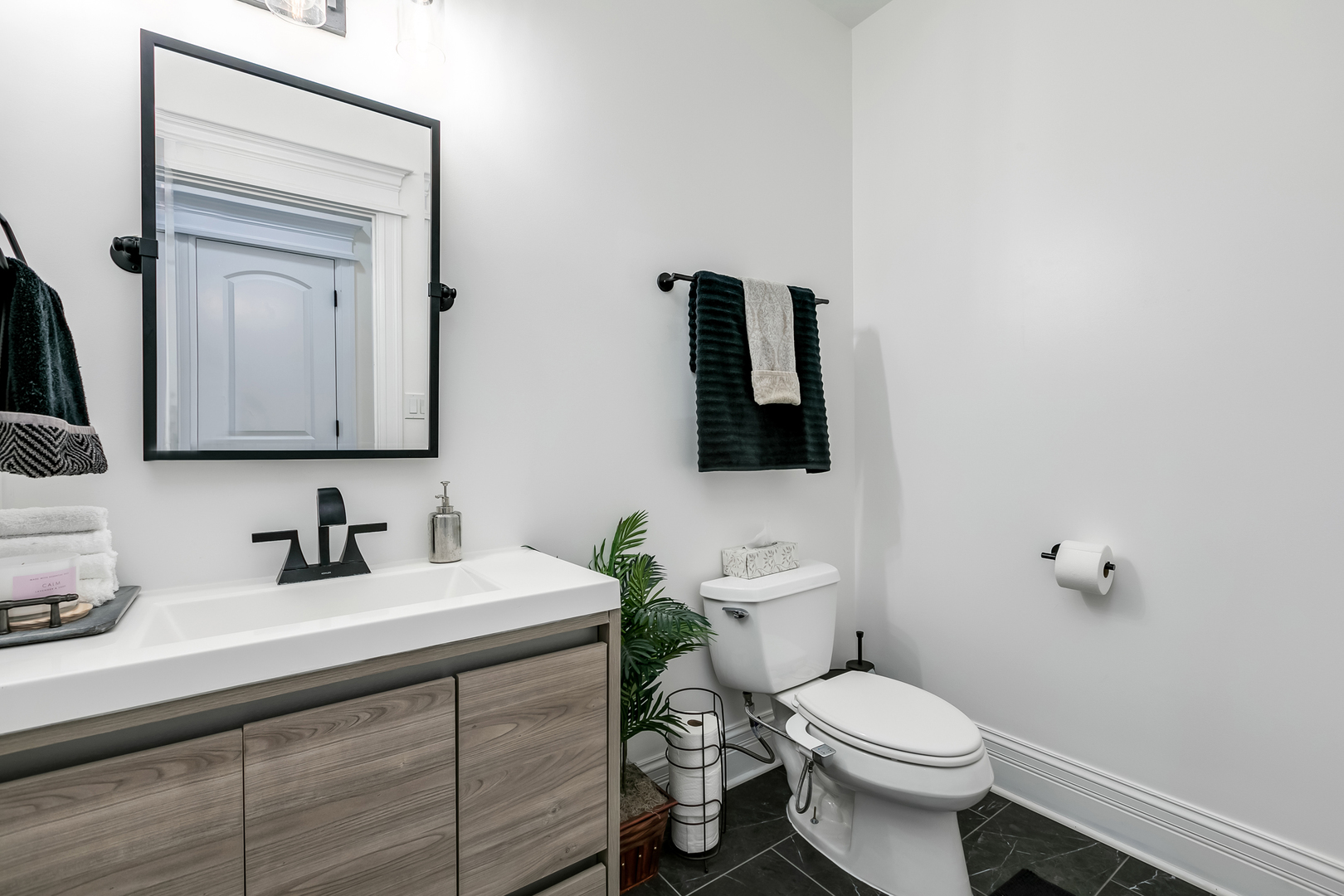 463 Summit Avenue, Unit D Park Ridge, IL 60068 - Photo 15 of 30 a bathroom with a toilet sink and mirror