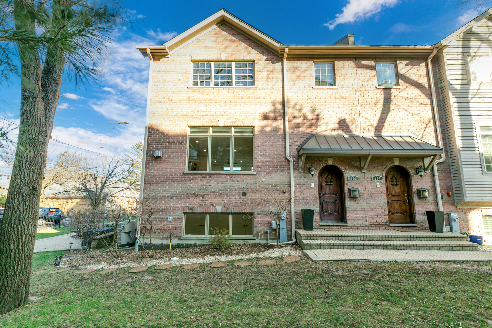 463 Summit Avenue, Unit D Park Ridge, IL 60068 - Photo 2 of 30 a front view of a house with a garden
