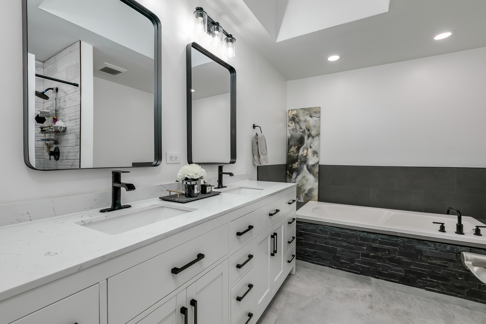 463 Summit Avenue, Unit D Park Ridge, IL 60068 - Photo 22 of 30 a bathroom with a double vanity sink a mirror and bathtub
