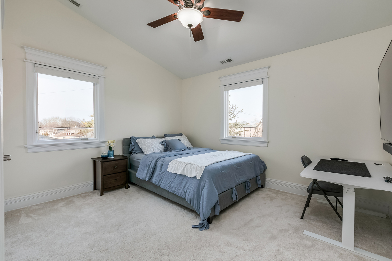 463 Summit Avenue, Unit D Park Ridge, IL 60068 - Photo 25 of 30 a bedroom with a bed and a chandelier