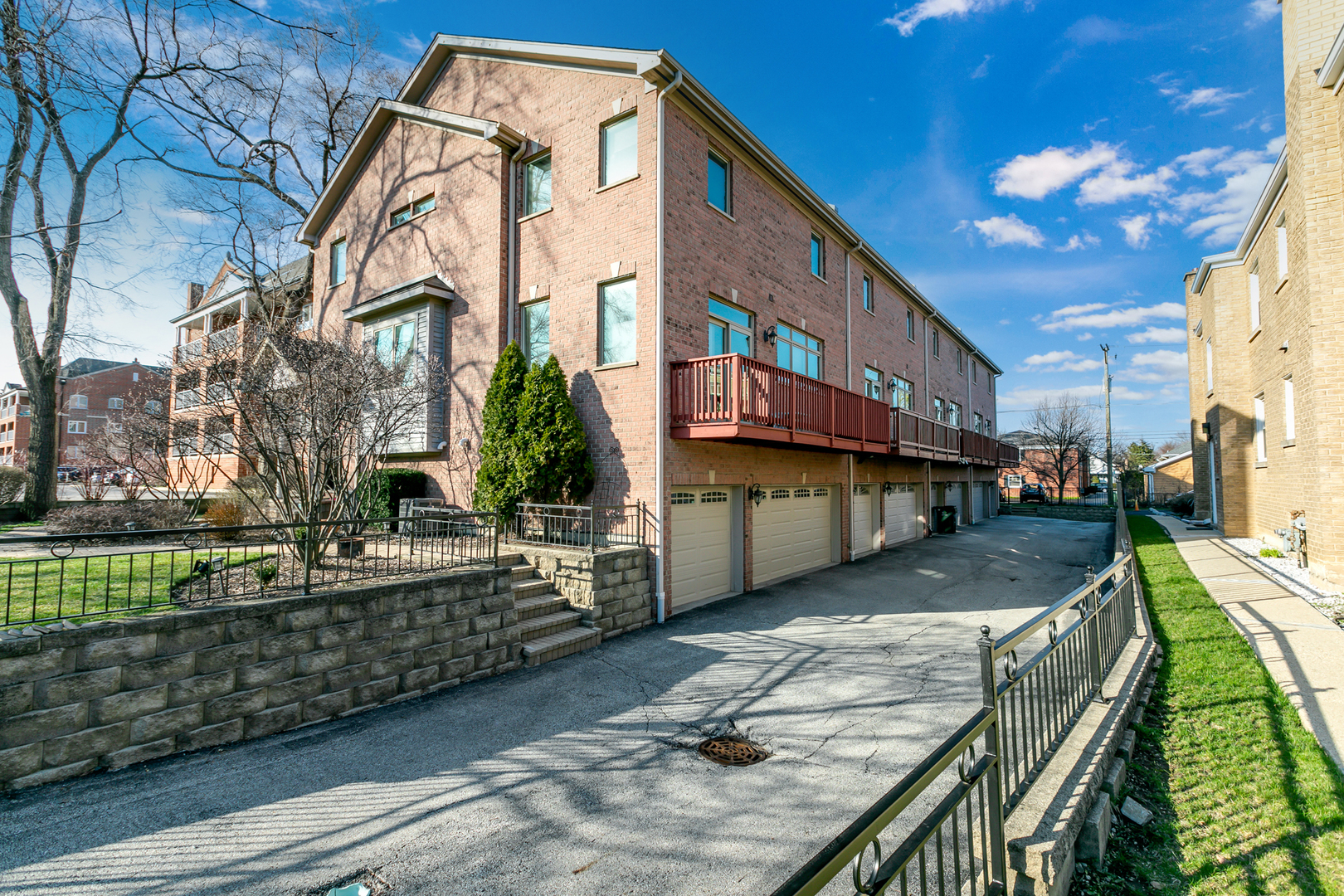 463 Summit Avenue, Unit D Park Ridge, IL 60068 - Photo 29 of 30 a street view with tall buildings and a yard