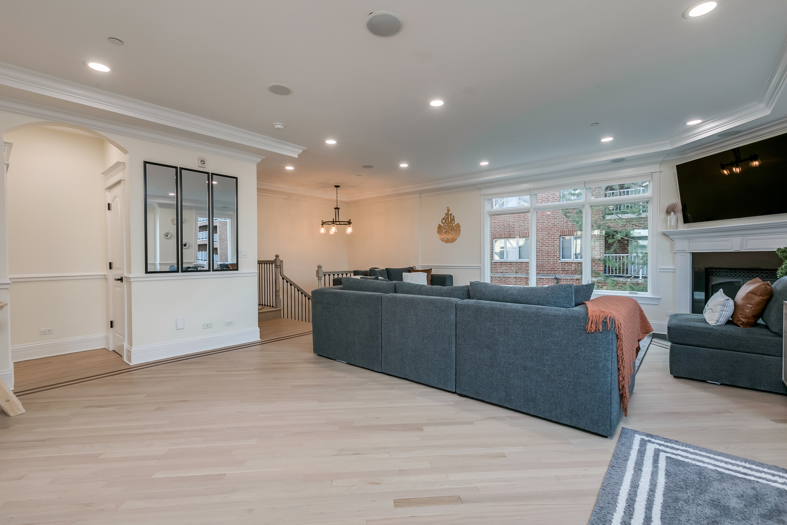 463 Summit Avenue, Unit D Park Ridge, IL 60068 - Photo 8 of 30 a living room with furniture and a flat screen tv