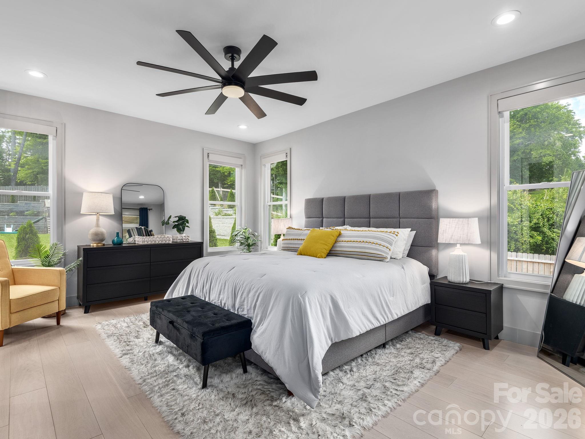 7 Copper Mill Court Candler, NC 28715 - Photo 13 of 32 a bed room with a bed and a window