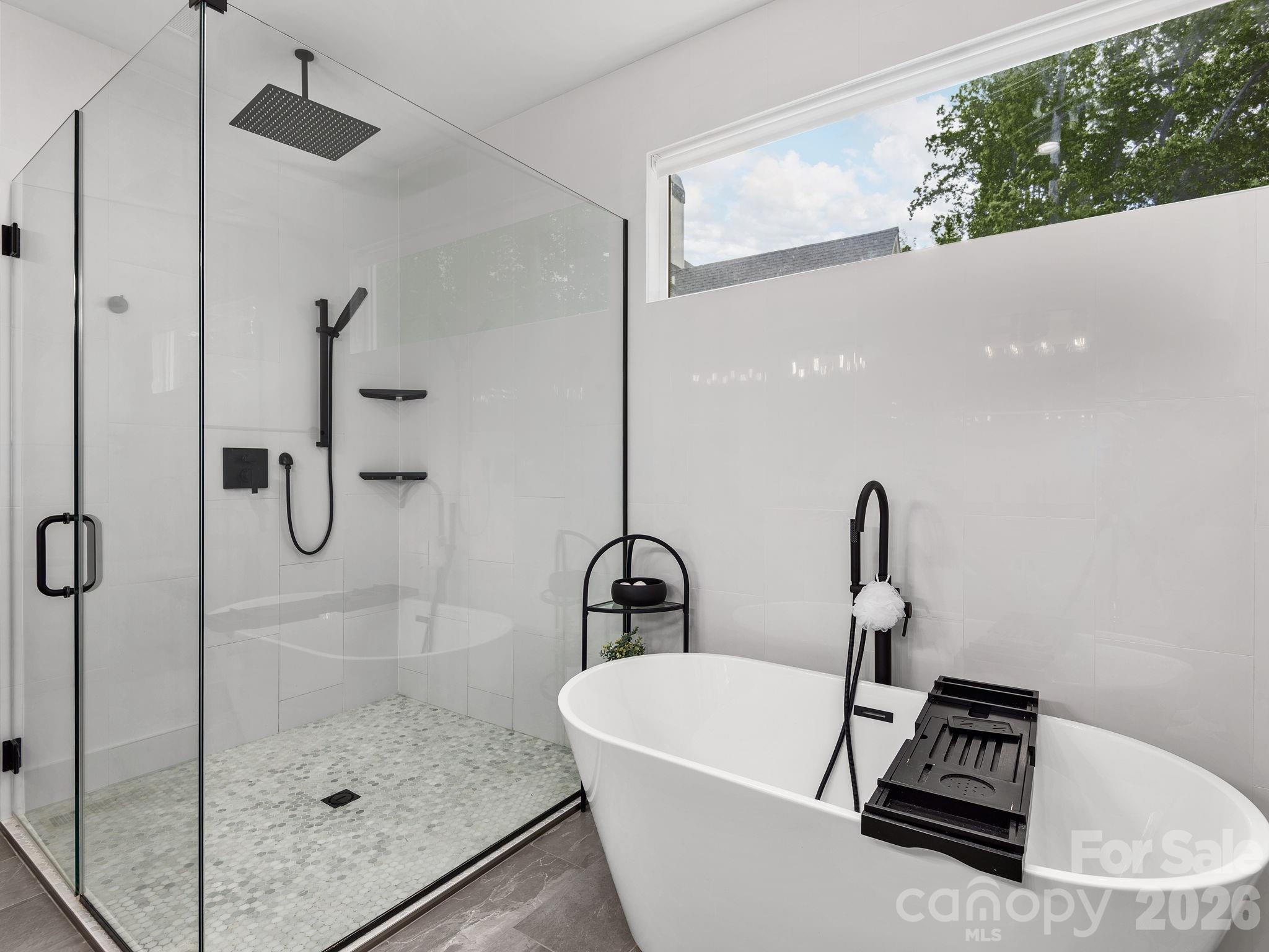 7 Copper Mill Court Candler, NC 28715 - Photo 16 of 32 a bathroom with a sink and a mirror