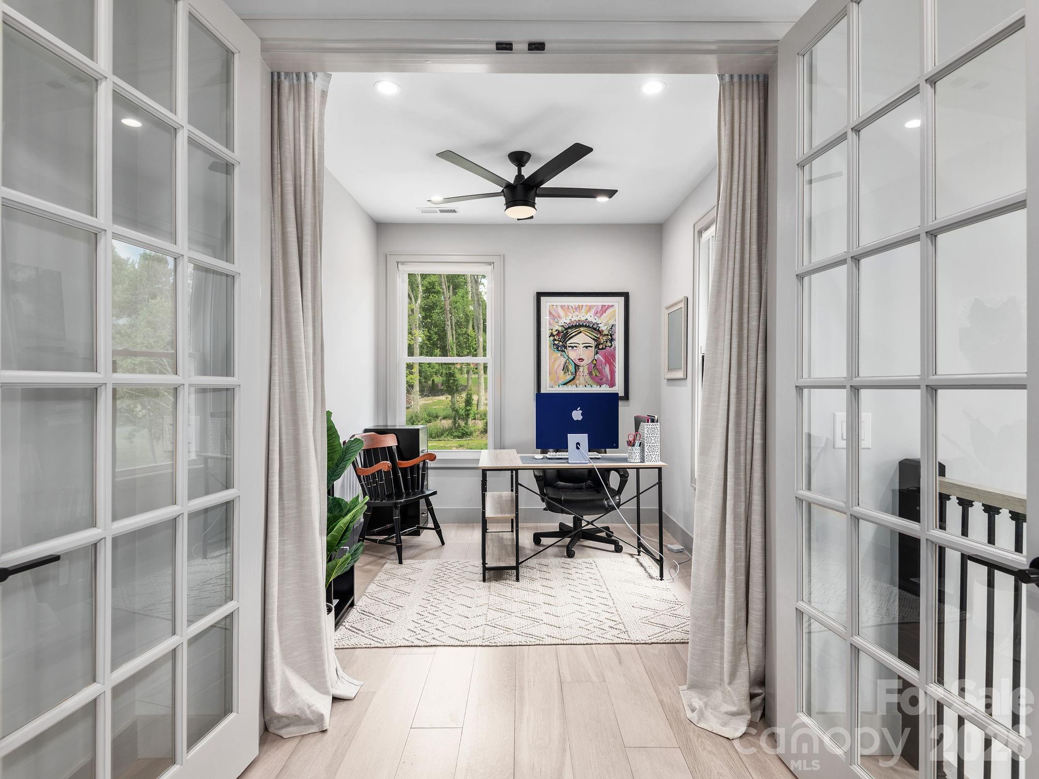 7 Copper Mill Court Candler, NC 28715 - Photo 20 of 32 a view of a livingroom with workspace and a window