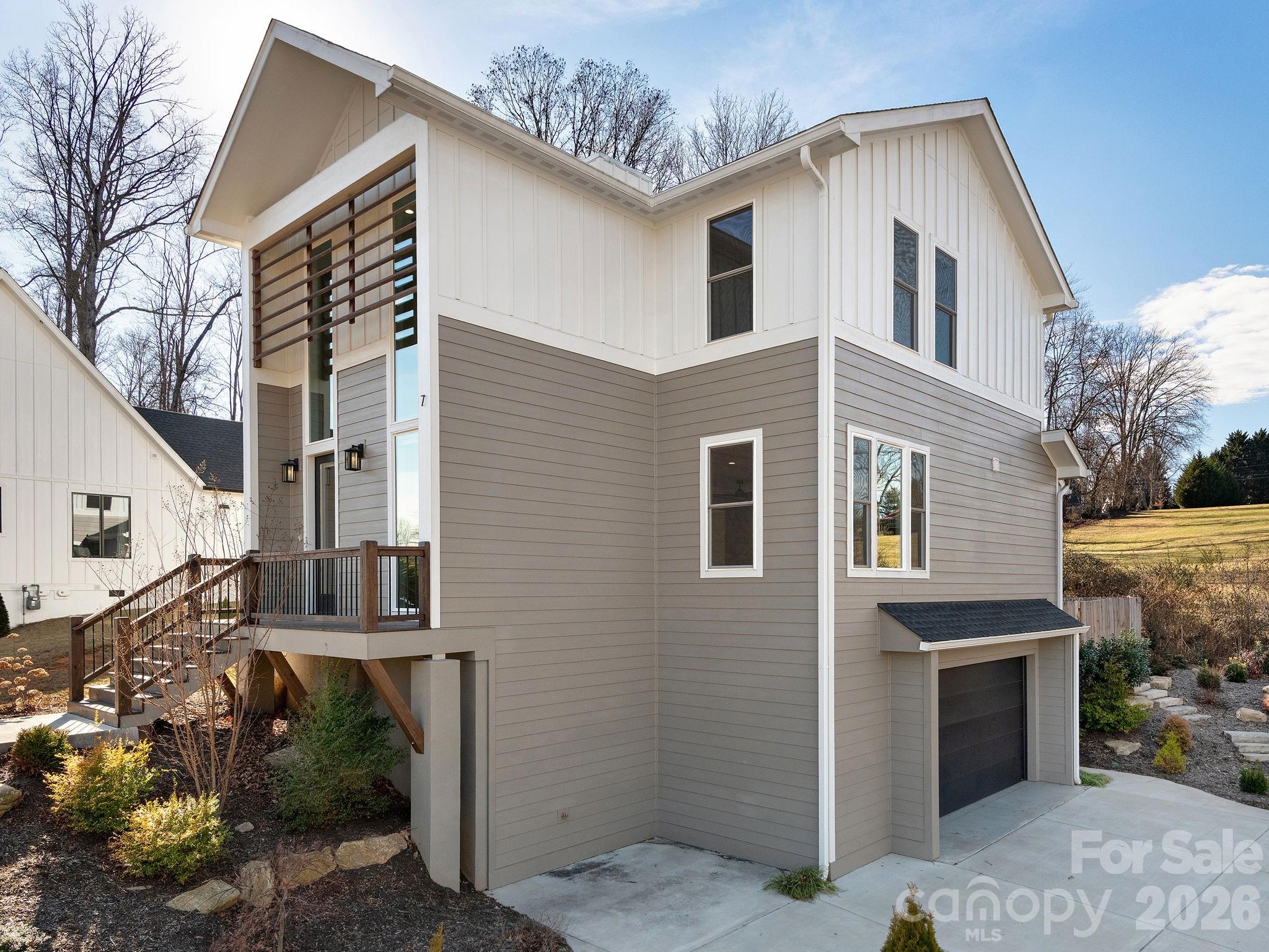 7 Copper Mill Court Candler, NC 28715 - Photo 31 of 32 a view of a house with a yard