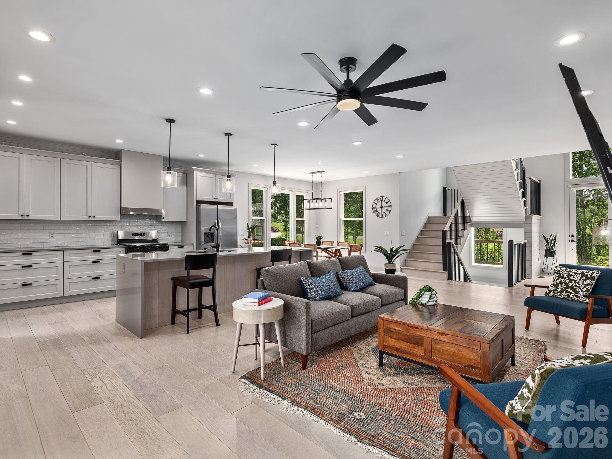 7 Copper Mill Court Candler, NC 28715 - Photo 6 of 32 a living room kitchen with furniture and kitchen view