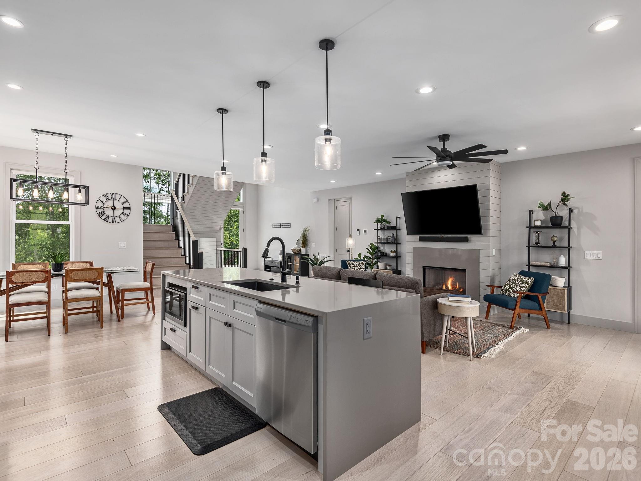 7 Copper Mill Court Candler, NC 28715 - Photo 7 of 32 a kitchen with stainless steel appliances kitchen island a large island in the center