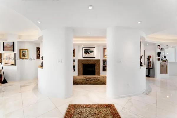 a spacious bathroom with a granite countertop sink and a mirror