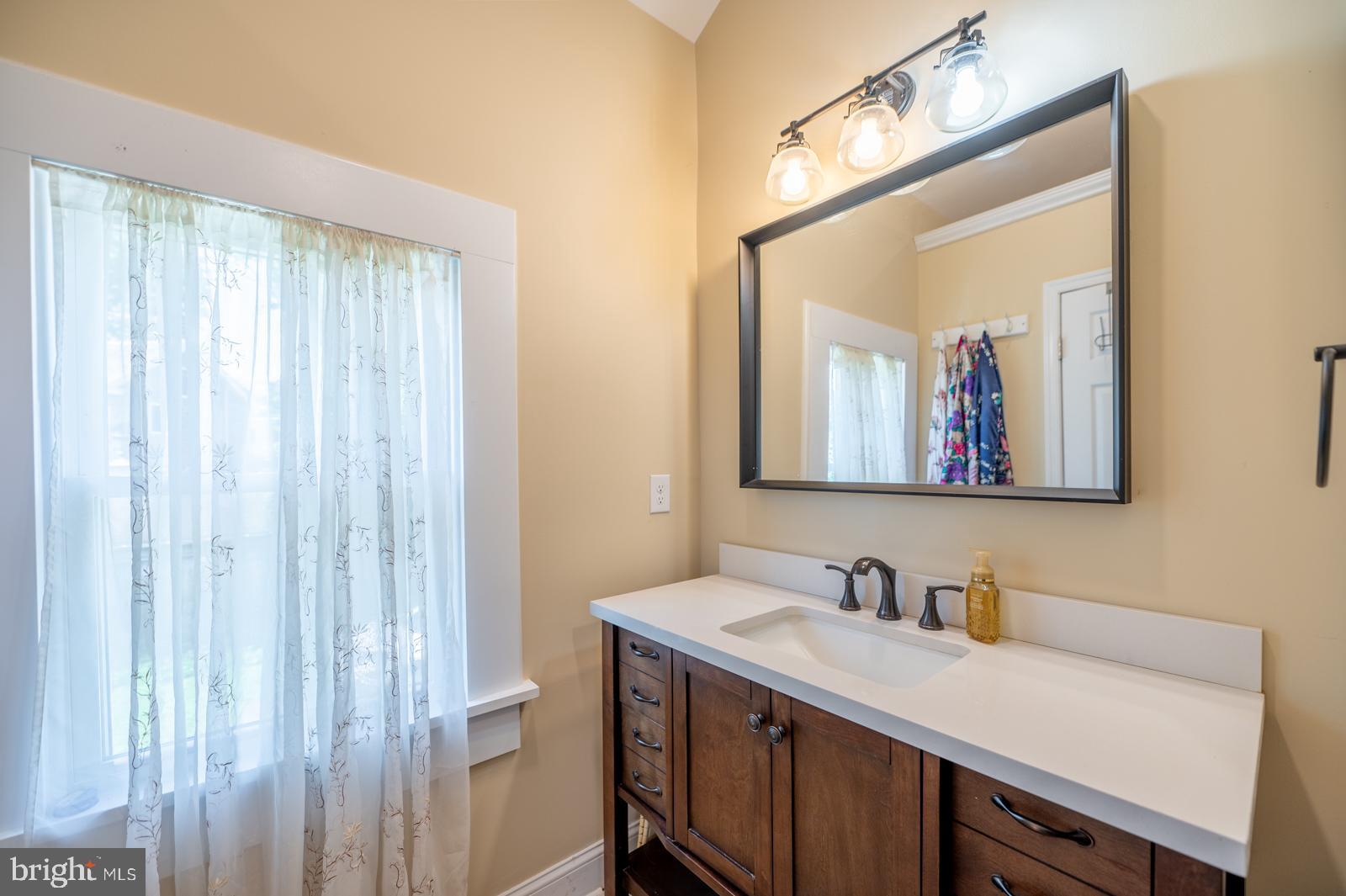 494 Baptist Church Road Spring City, PA 19475 - Photo 24 of 49 a bathroom with a double vanity sink and a mirror