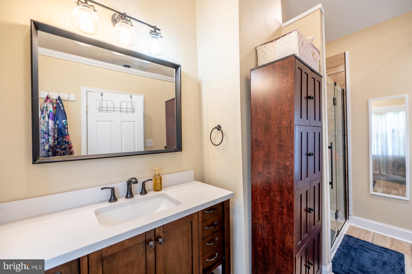 494 Baptist Church Road Spring City, PA 19475 - Photo 25 of 49 a bathroom with a sink vanity and a mirror