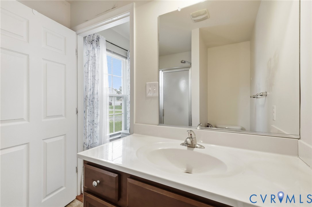 10155 Virginia Road Glen Allen, VA 23060 - Photo 27 of 50 White vanity with integrated sink, brushed nickel