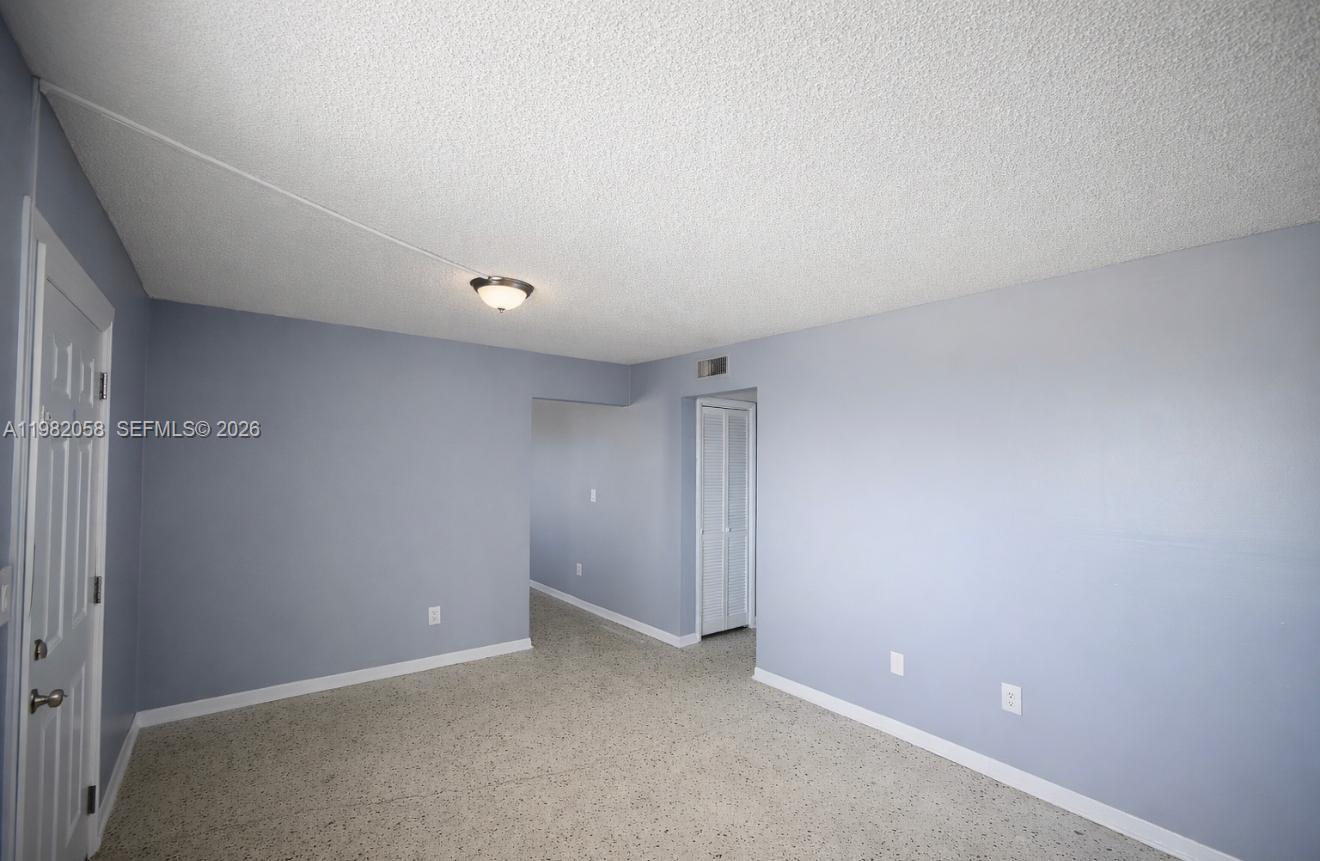 2315 West Okeechobee Road, Unit 202 Hialeah, FL 33010 - Photo 4 of 10 a view of an empty room