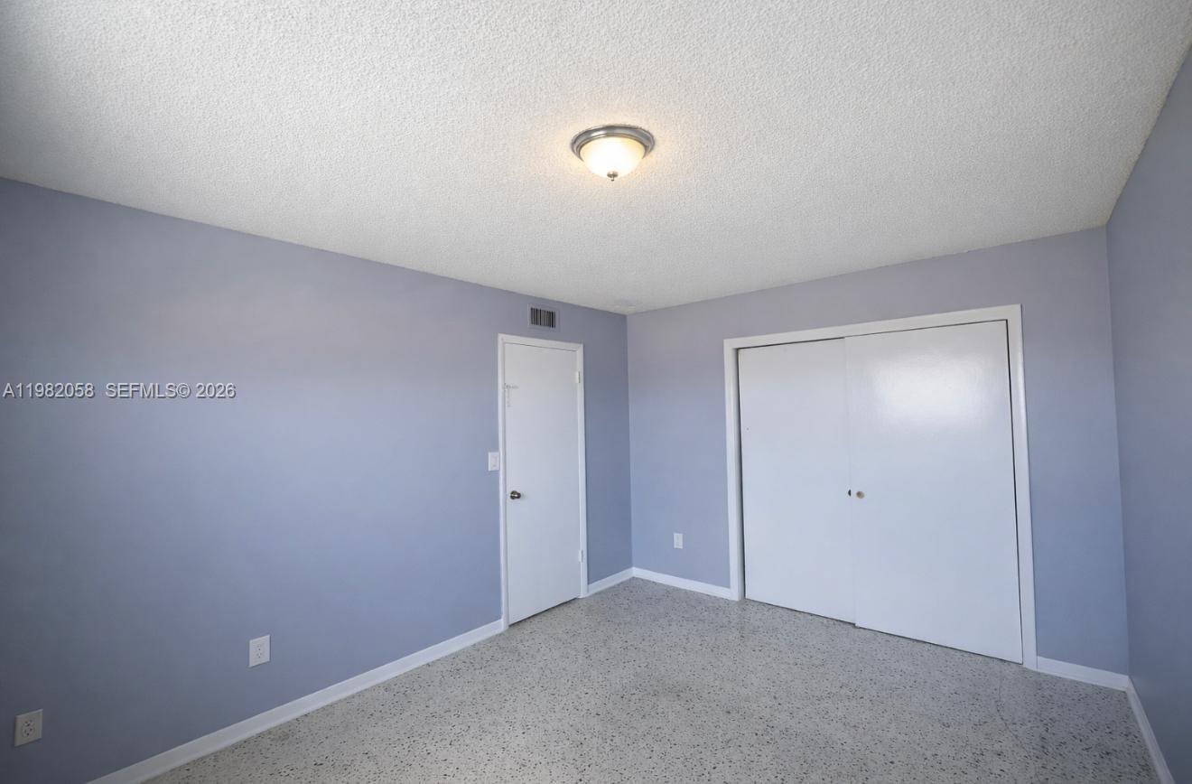 2315 West Okeechobee Road, Unit 202 Hialeah, FL 33010 - Photo 7 of 10 a view of an empty room