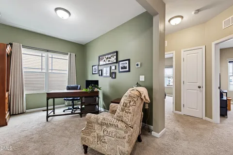 a bedroom with furniture and a window