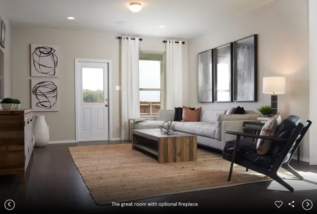 a living room with furniture window and wooden floor