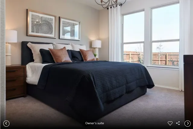 a bedroom with bed and window