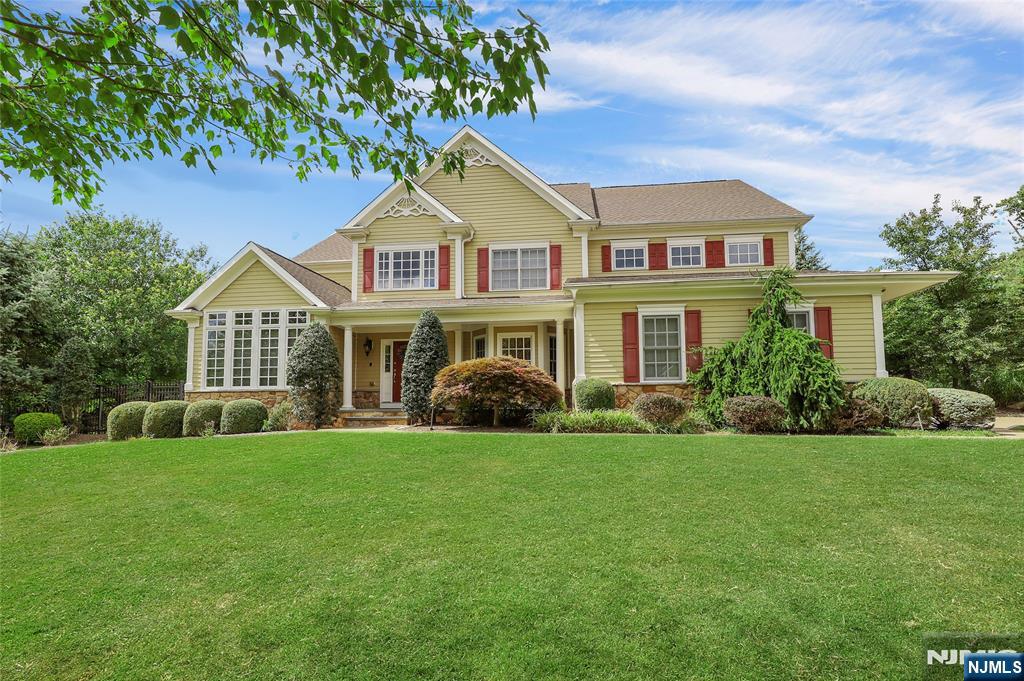 22 Meadowlake Drive Mahwah, NJ 07430 - Photo 1 of 39 a front view of a house with a garden