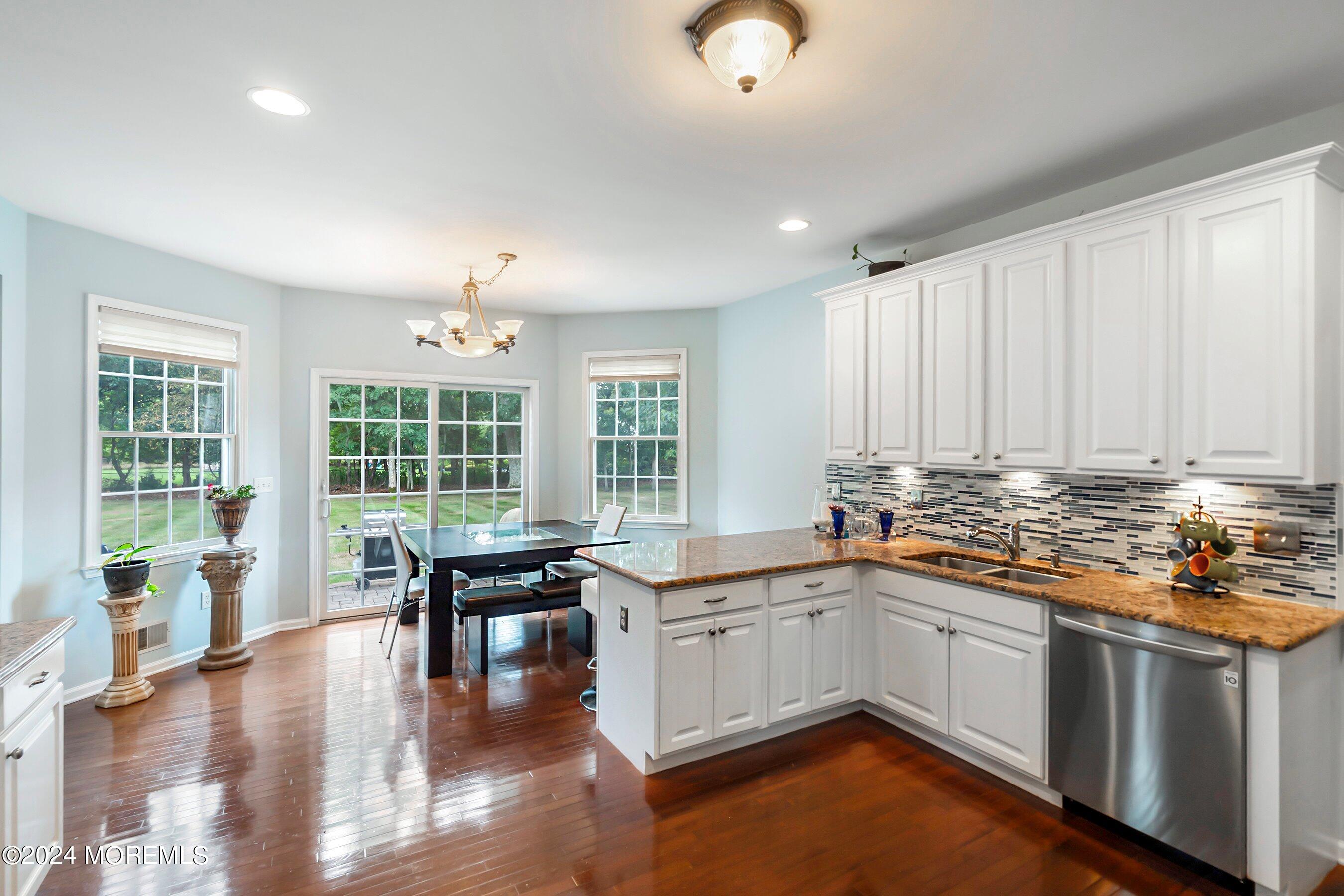 5 Summers Drive Jackson, NJ 08527 - Photo 16 of 40 a kitchen with stainless steel appliances granite countertop a stove and cabinets