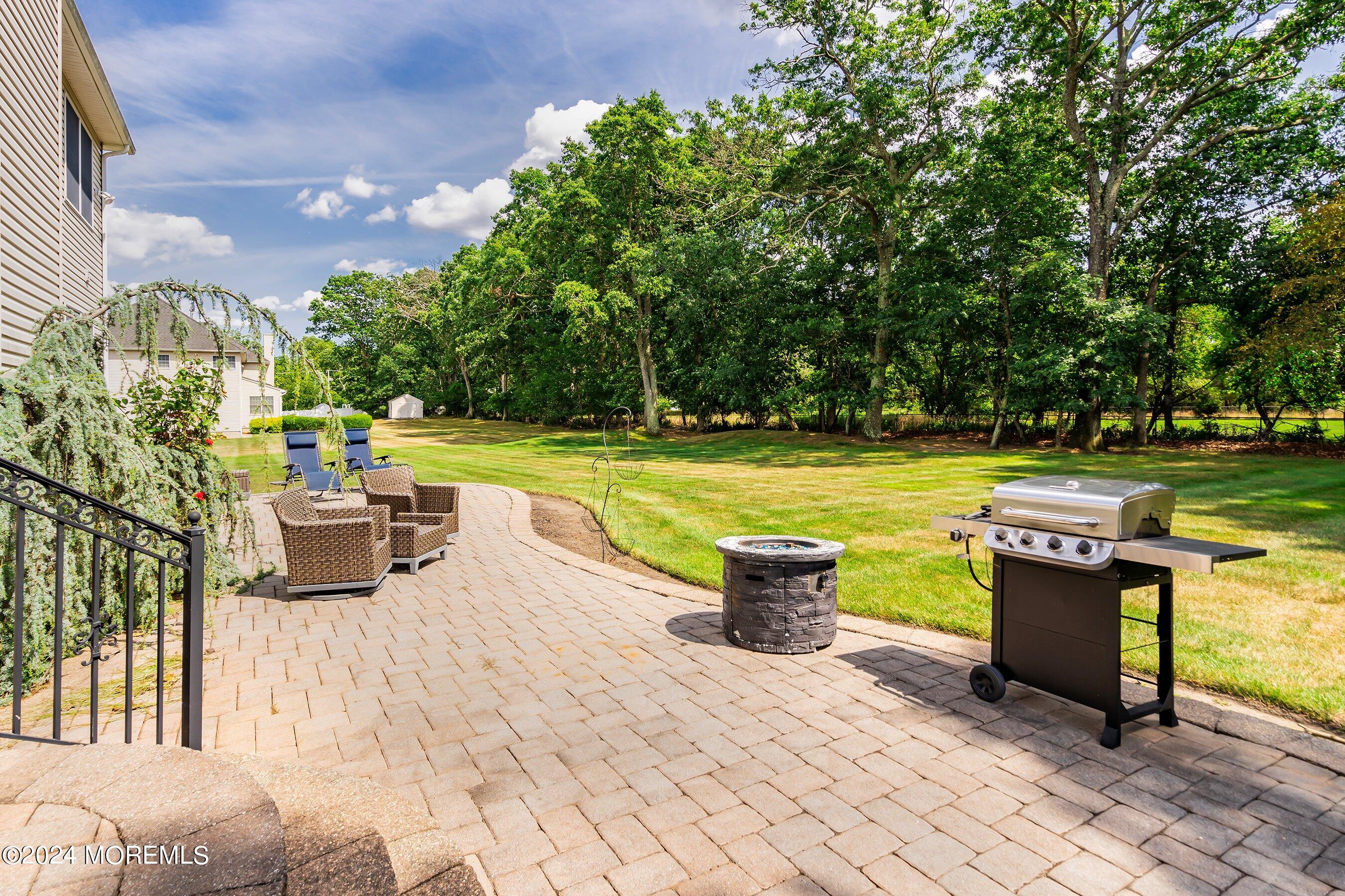 5 Summers Drive Jackson, NJ 08527 - Photo 33 of 40 a view of a patio with dining table and chairs