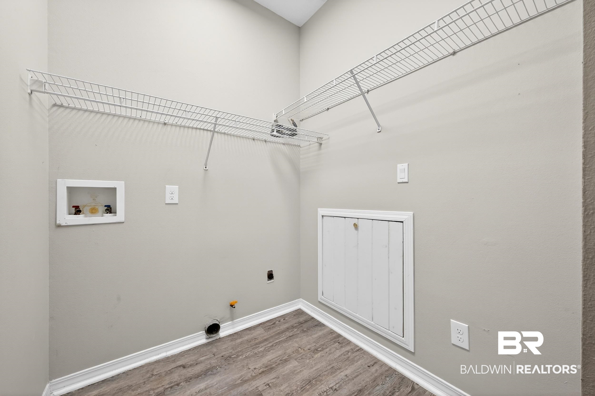 7050 Highpointe Place West Daphne, AL 36527 - Photo 33 of 66 Laundry room featuring gas dryer hookup, hookup for a washing machine, and light wood-style floors