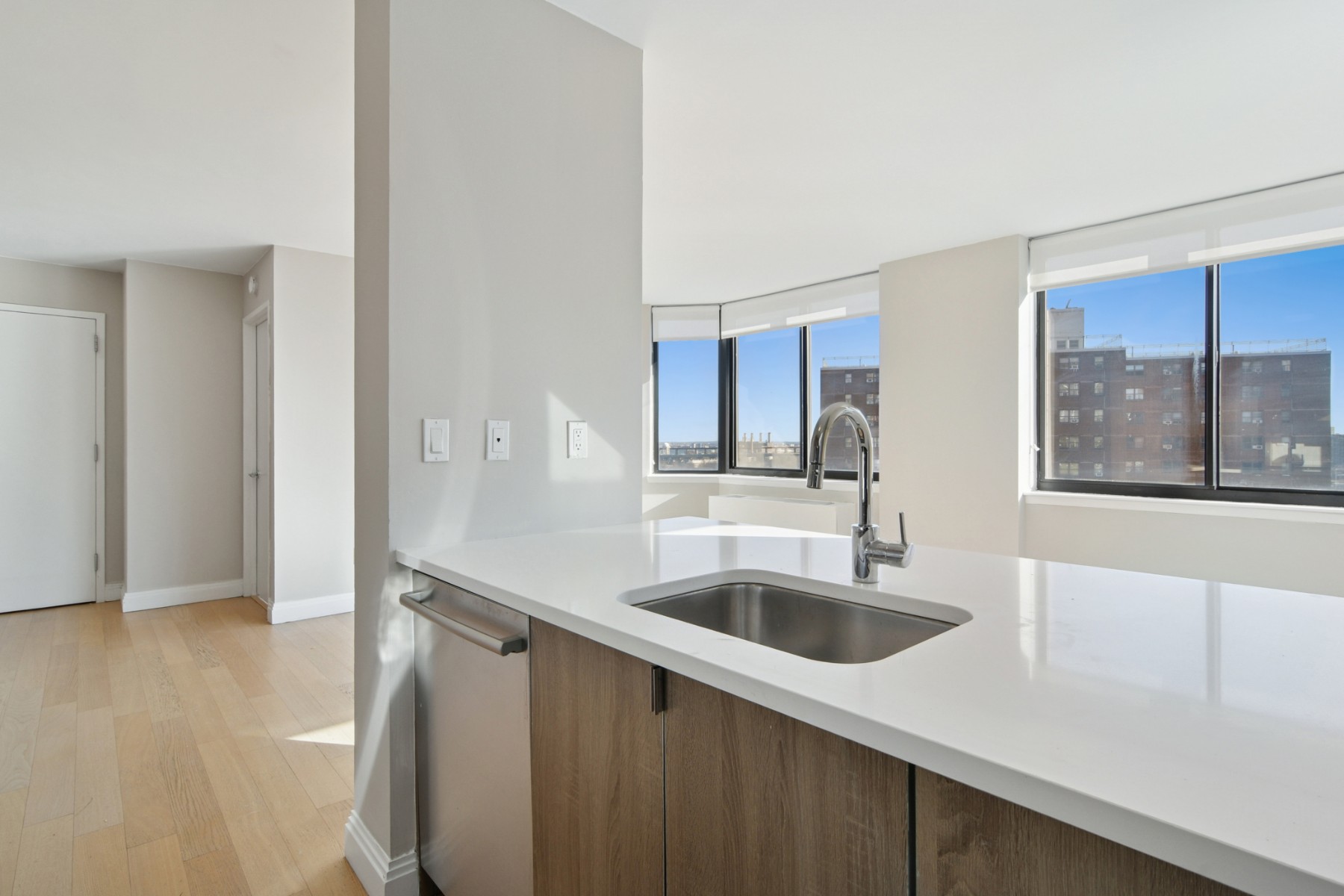 345 East 94th Street, Unit 21C Manhattan, NY 10128 - Photo 6 of 29 a kitchen with a sink and a large window