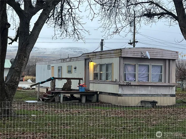 a front view of a house with swimming pool
