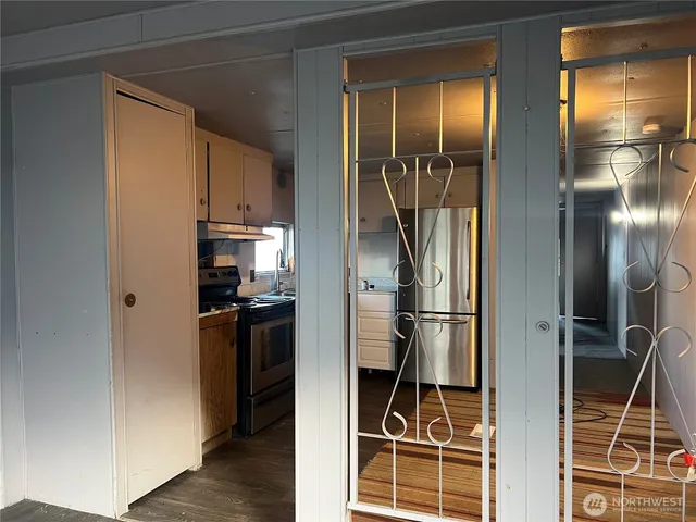 a kitchen with stainless steel appliances a refrigerator and cabinets