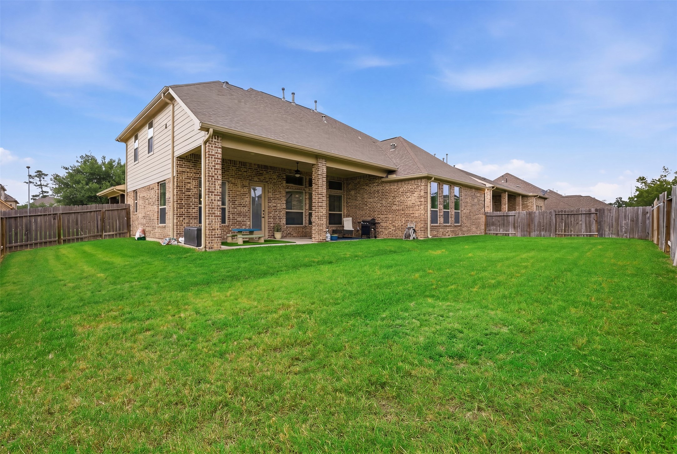 6835 Preston Grove Drive Spring, TX 77389 - Photo 43 of 49 a view of a house with a yard and sitting area