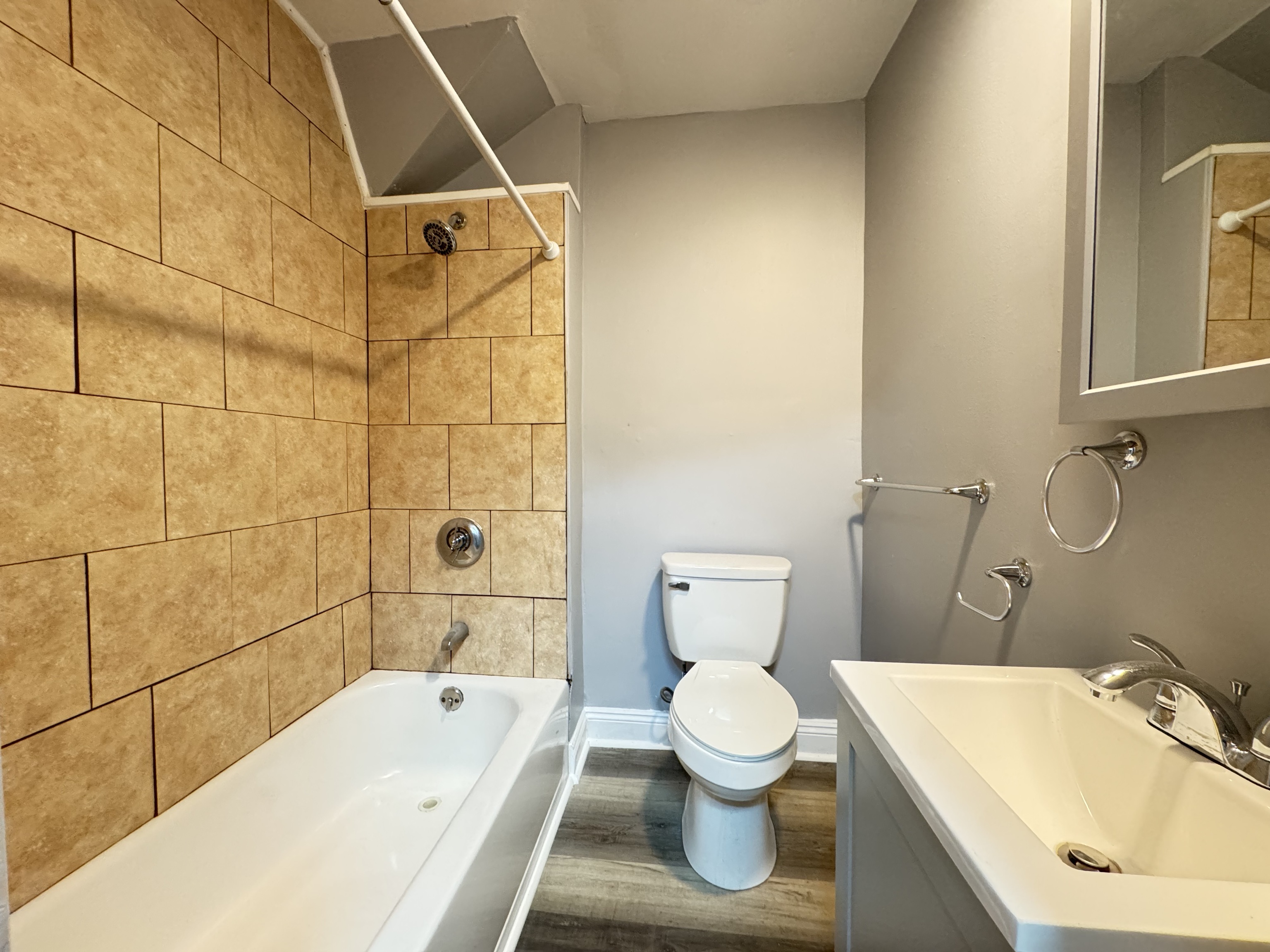 959 Winchester Avenue Hamden, CT 06517 - Photo 12 of 12 a bathroom with a sink and a bathtub