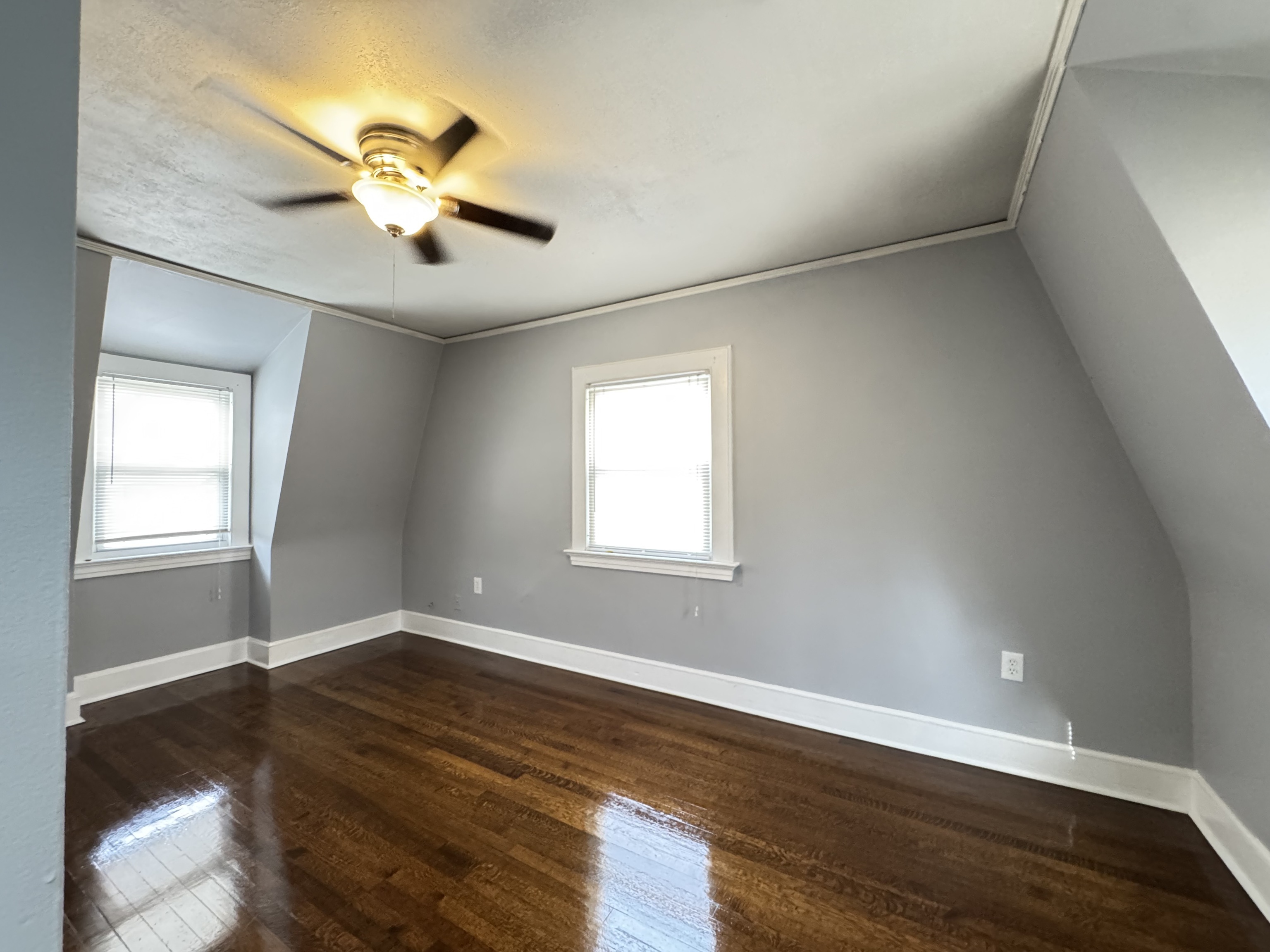 959 Winchester Avenue Hamden, CT 06517 - Photo 10 of 12 a view of an empty room with wooden floor and a window