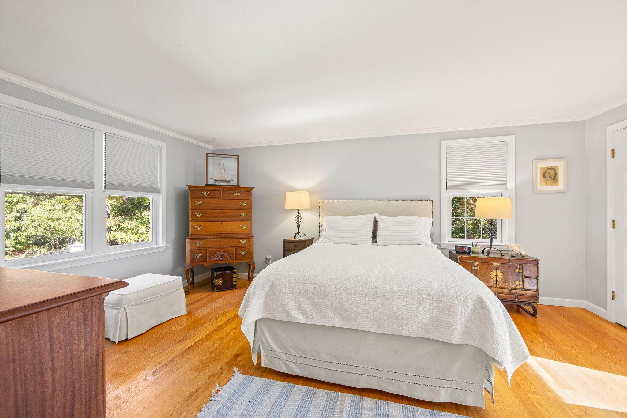 49 River Ridge Road Marstons Mills, MA 02648 - Photo 17 of 37 a bedroom with a bed and wooden floor