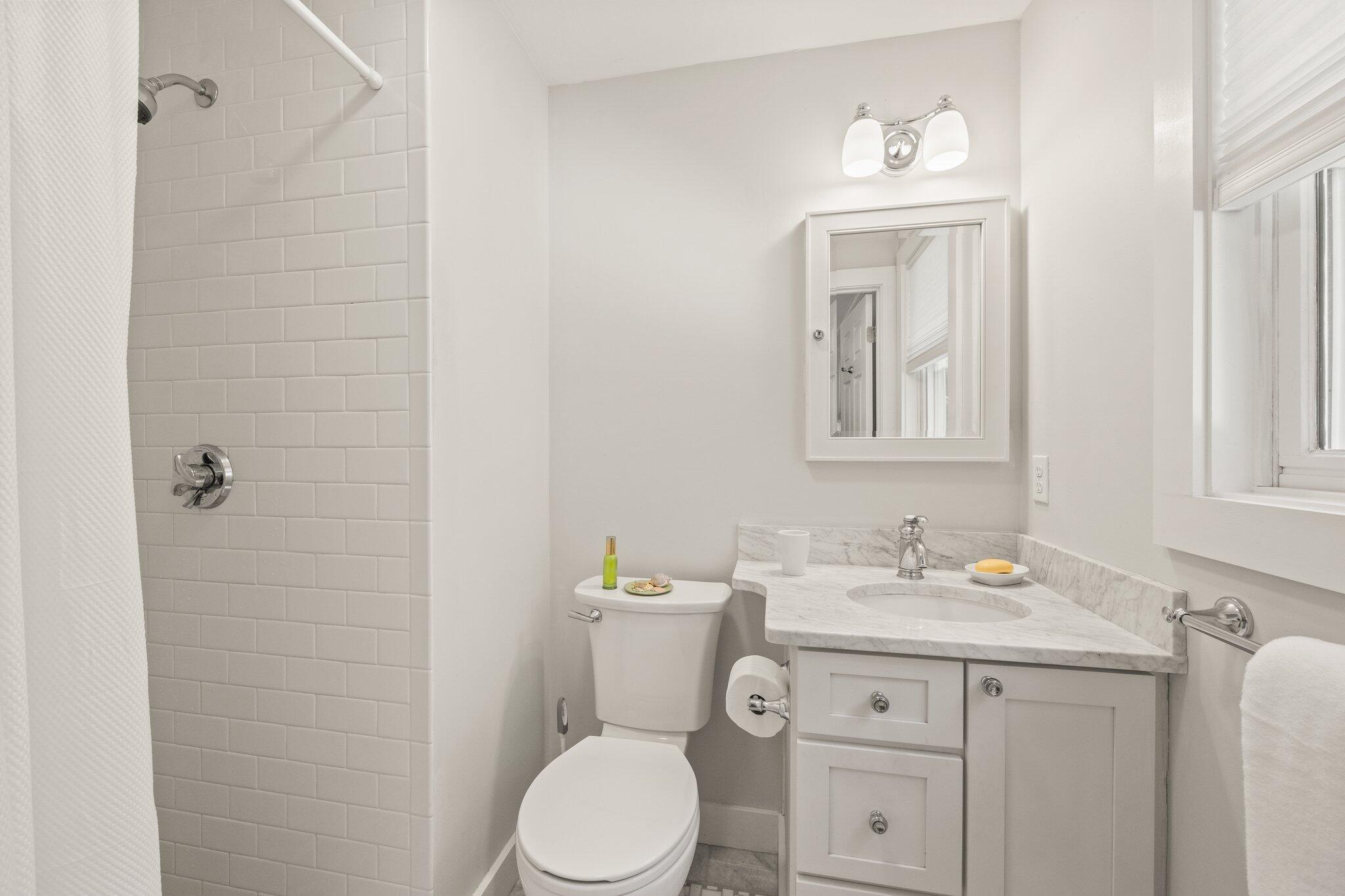 49 River Ridge Road Marstons Mills, MA 02648 - Photo 20 of 37 a bathroom with a toilet sink vanity and mirror