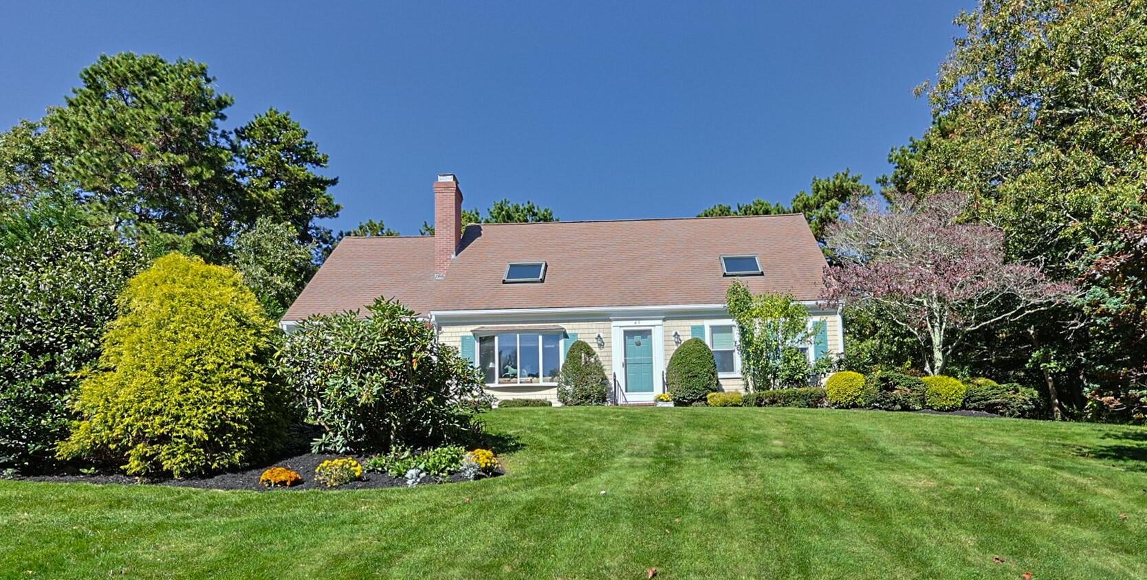 49 River Ridge Road Marstons Mills, MA 02648 - Photo 2 of 37 a front view of house with yard and green space
