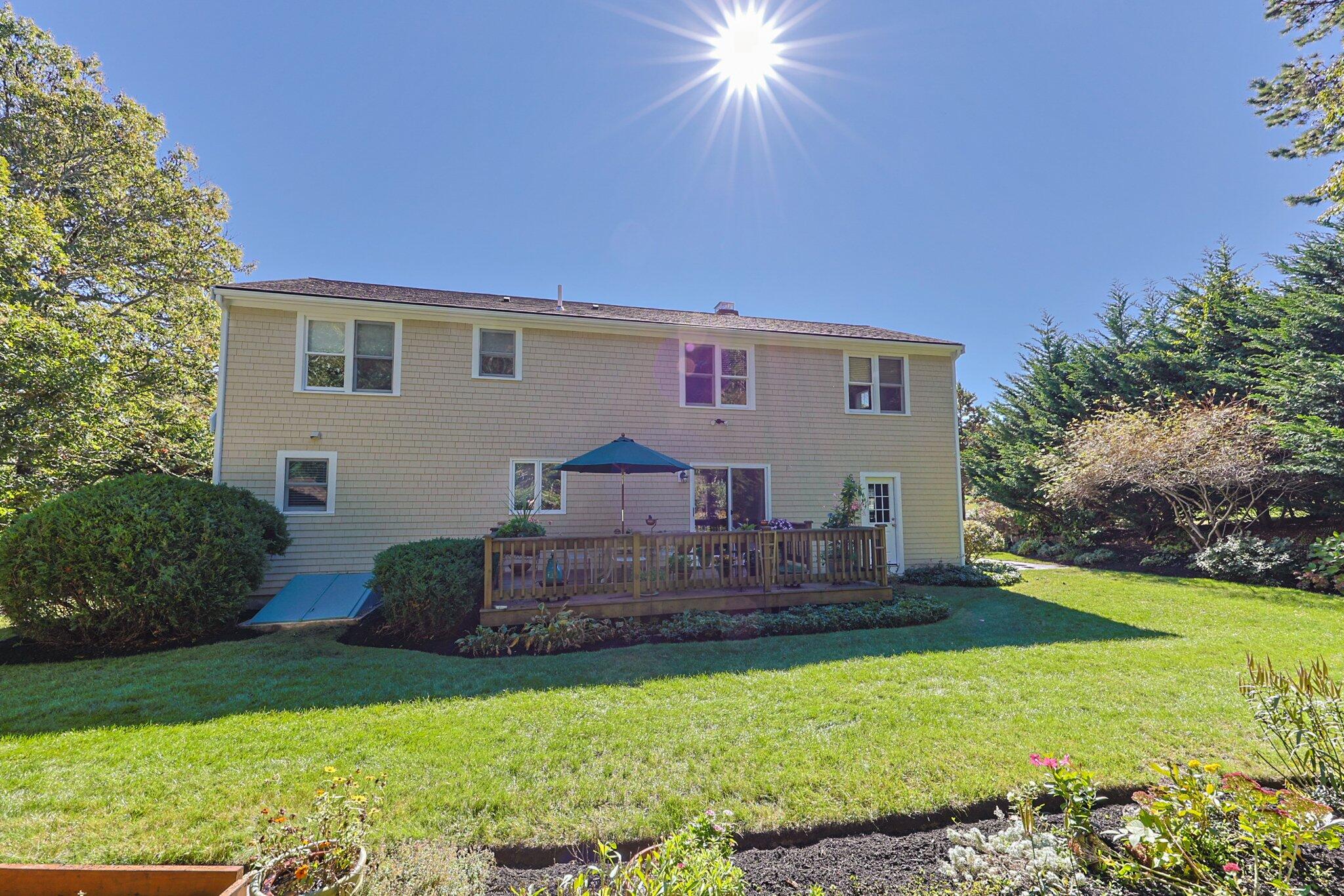 49 River Ridge Road Marstons Mills, MA 02648 - Photo 29 of 37 a front view of a house with a garden
