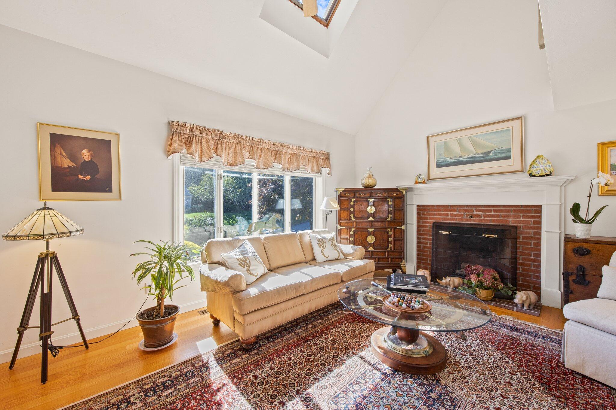 49 River Ridge Road Marstons Mills, MA 02648 - Photo 6 of 37 a living room with furniture a window and a fireplace