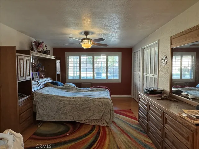 a bed room with a bed and a large window