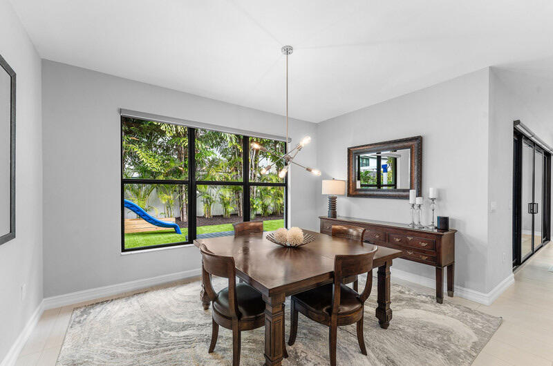 8091 Snowflake Obsidian Trail Delray Beach, FL 33446 - Photo 12 of 35 a view of a dining room with furniture window and outside view