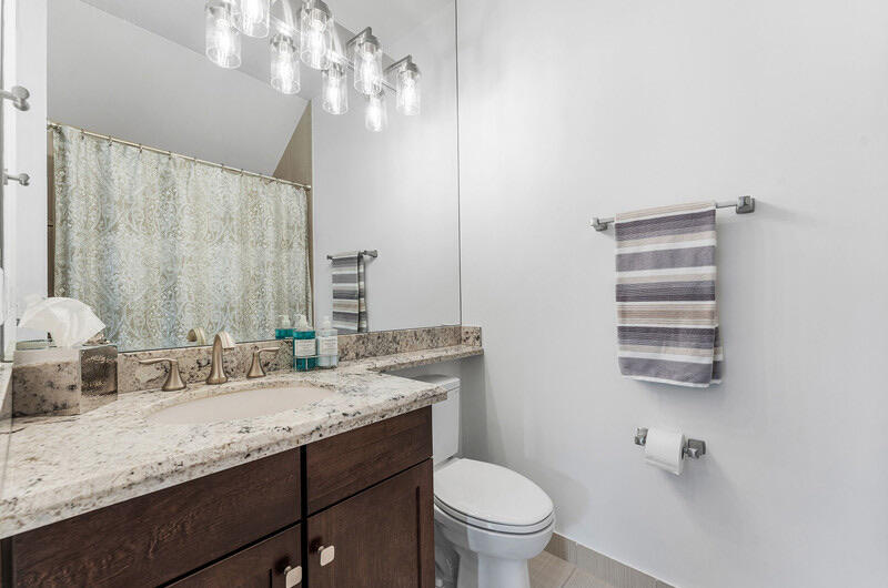 8091 Snowflake Obsidian Trail Delray Beach, FL 33446 - Photo 16 of 35 a bathroom with a granite countertop sink a toilet and a mirror