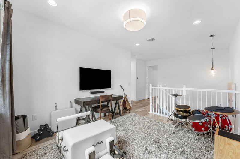 8091 Snowflake Obsidian Trail Delray Beach, FL 33446 - Photo 18 of 35 a living room with furniture and a flat screen tv