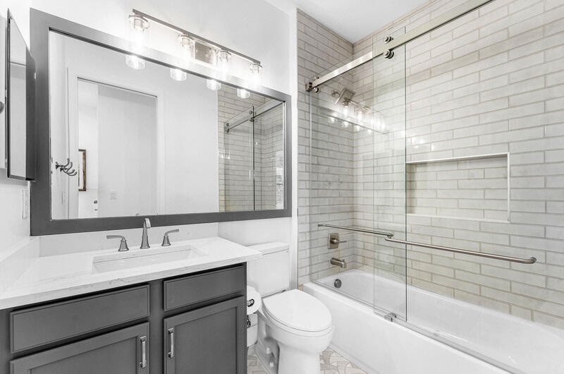8091 Snowflake Obsidian Trail Delray Beach, FL 33446 - Photo 23 of 35 a bathroom with a sink mirror toilet and bathtub