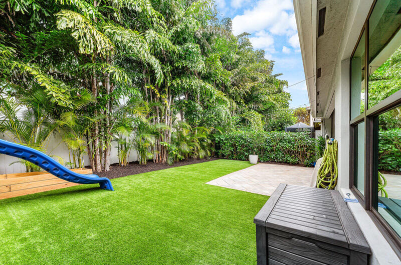8091 Snowflake Obsidian Trail Delray Beach, FL 33446 - Photo 35 of 35 a view of a wooden deck with a yard