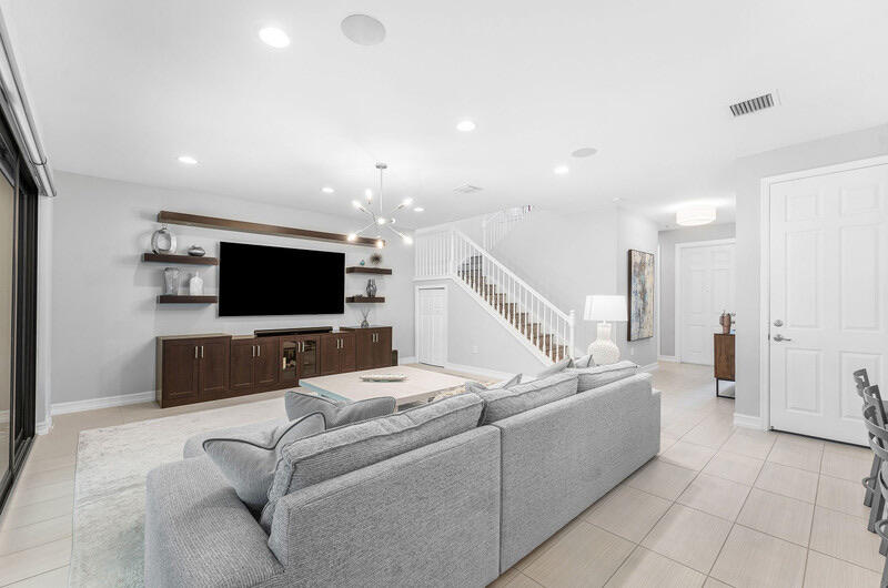 8091 Snowflake Obsidian Trail Delray Beach, FL 33446 - Photo 6 of 35 a living room with furniture and a flat screen tv