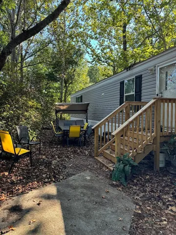 a view of a house with a backyard