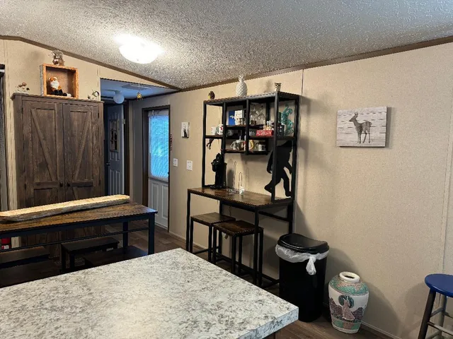 a room with furniture a rug and a window