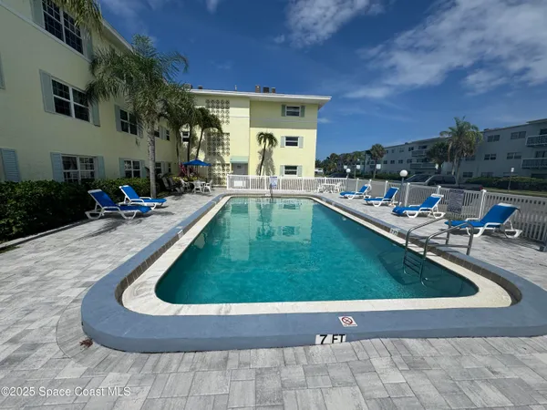 a view of swimming pool with outdoor seating