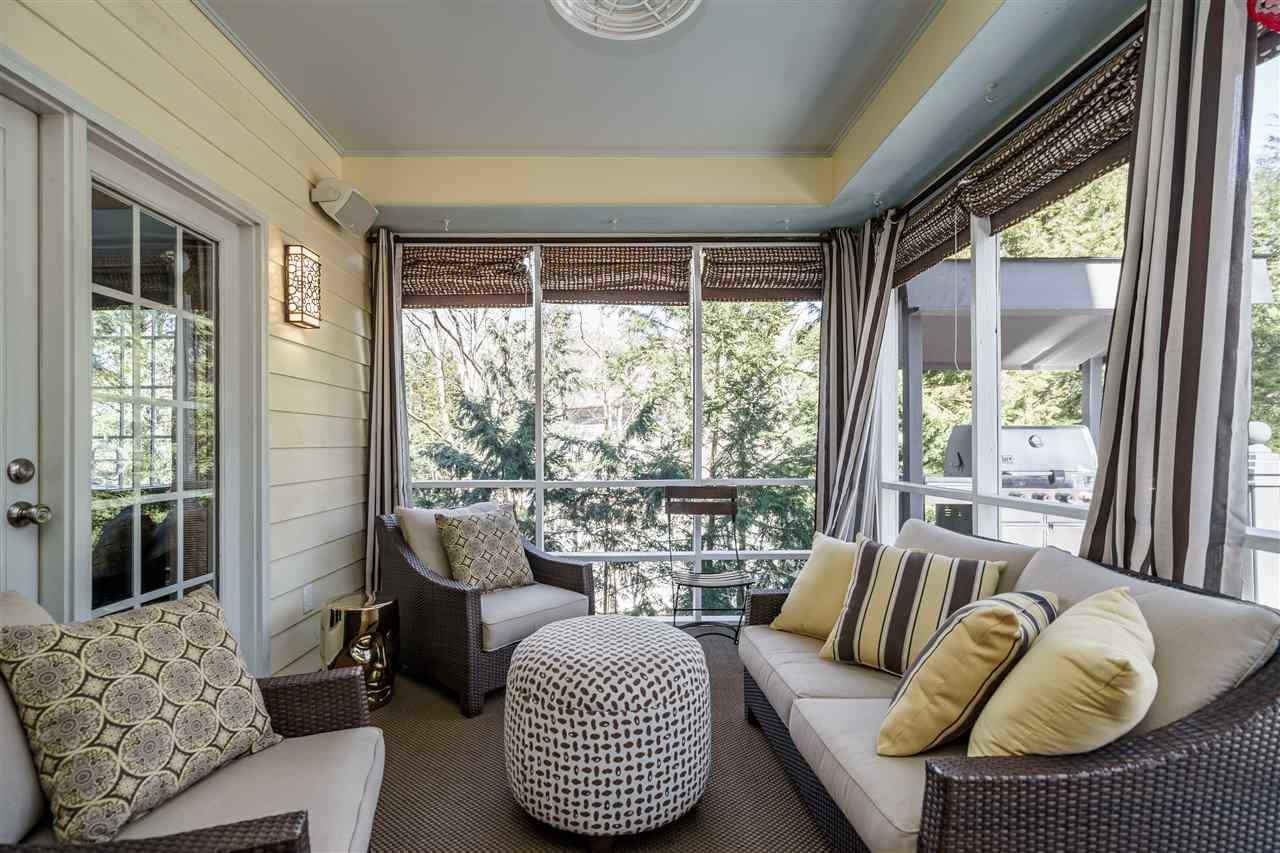3916 Hemsbury Way Raleigh, NC 27612 - Photo 26 of 30 Relax and Enjoy this porch with TV and Custom Cabinets for entertaining. Beautiful drapes and Blinds will complete this custom home porch Screen Porch with Custom Curtains and Shades