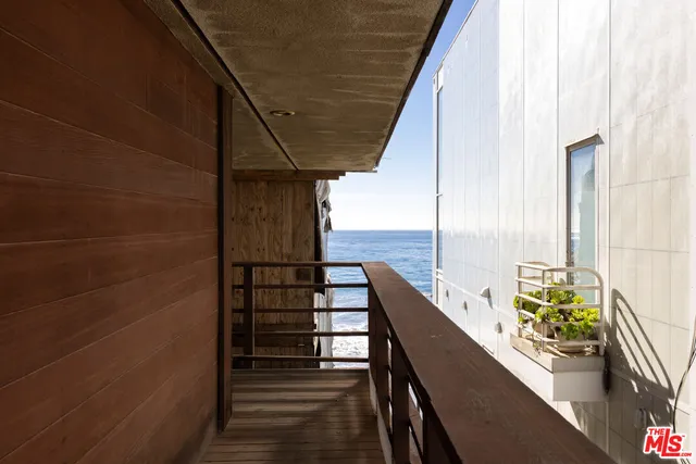 a view of balcony with furniture