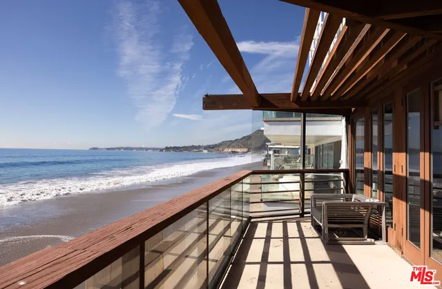 a view of swimming pool with furniture