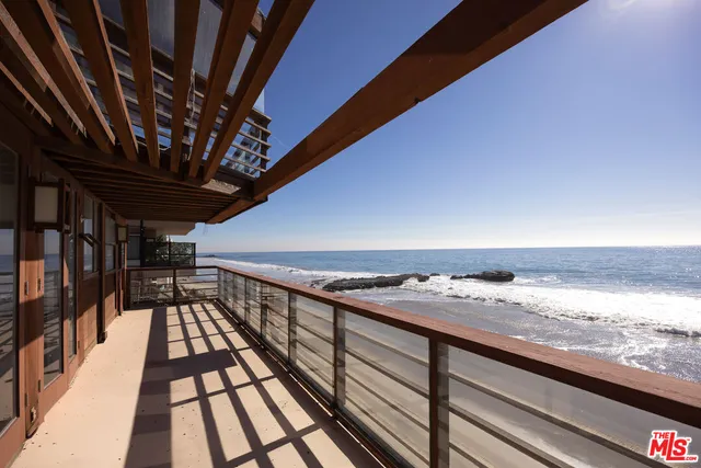 wooden floor in an empty room with wooden floor and a window